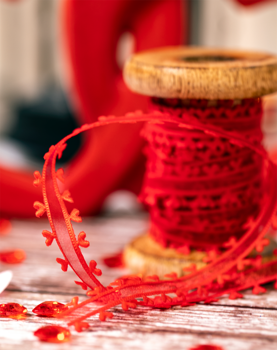 red sheer ribbon with heart cut out edges